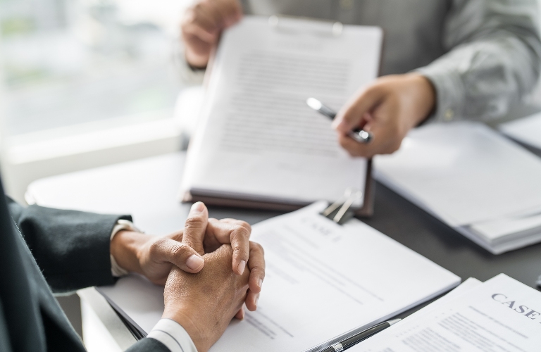 lawyer is reviewing with documents the client