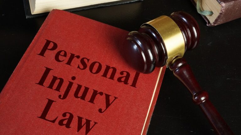 Personal injury law book and judge's gavel