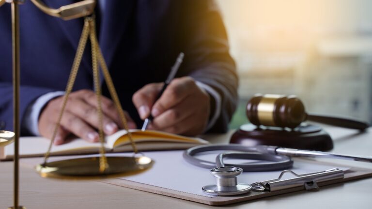 Lawyer, judge's gavel and stethoscope