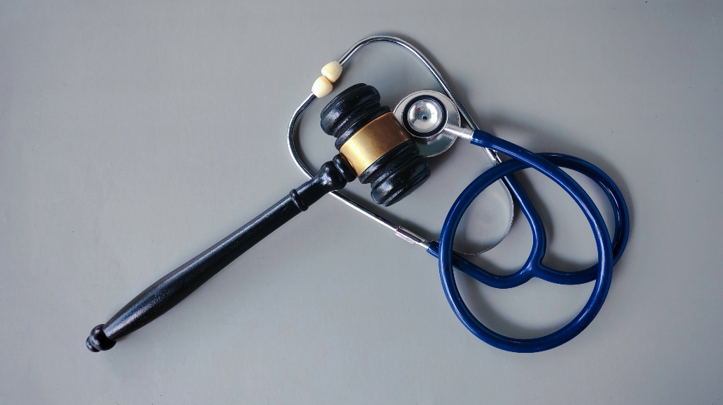 judge's gavel and stethoscope