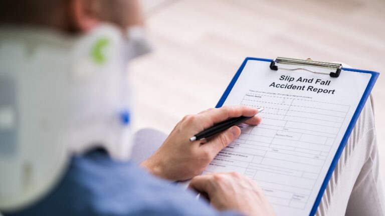 Injured man is filling slip and fall accident report
