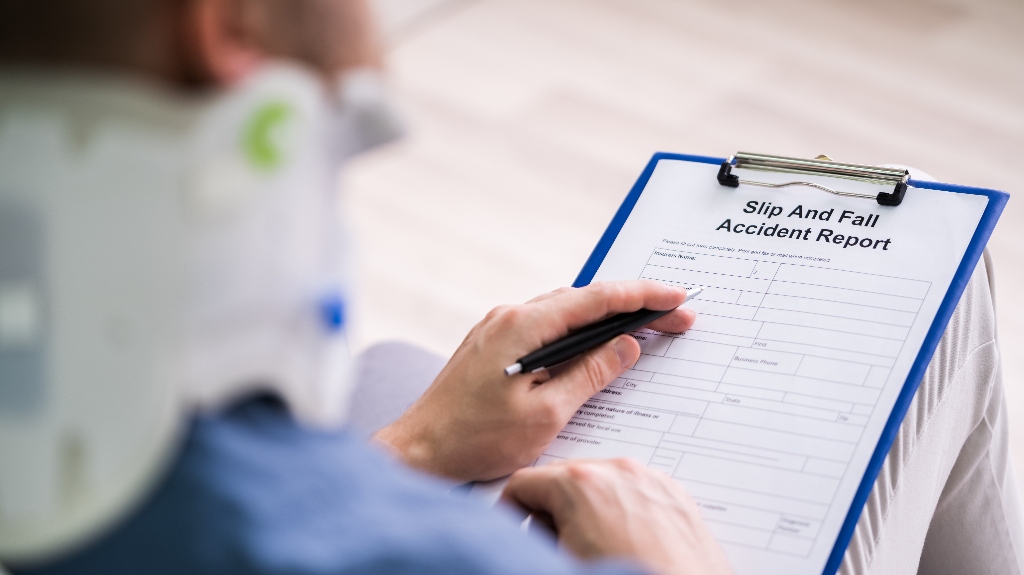 Injured man is filling slip and fall accident report